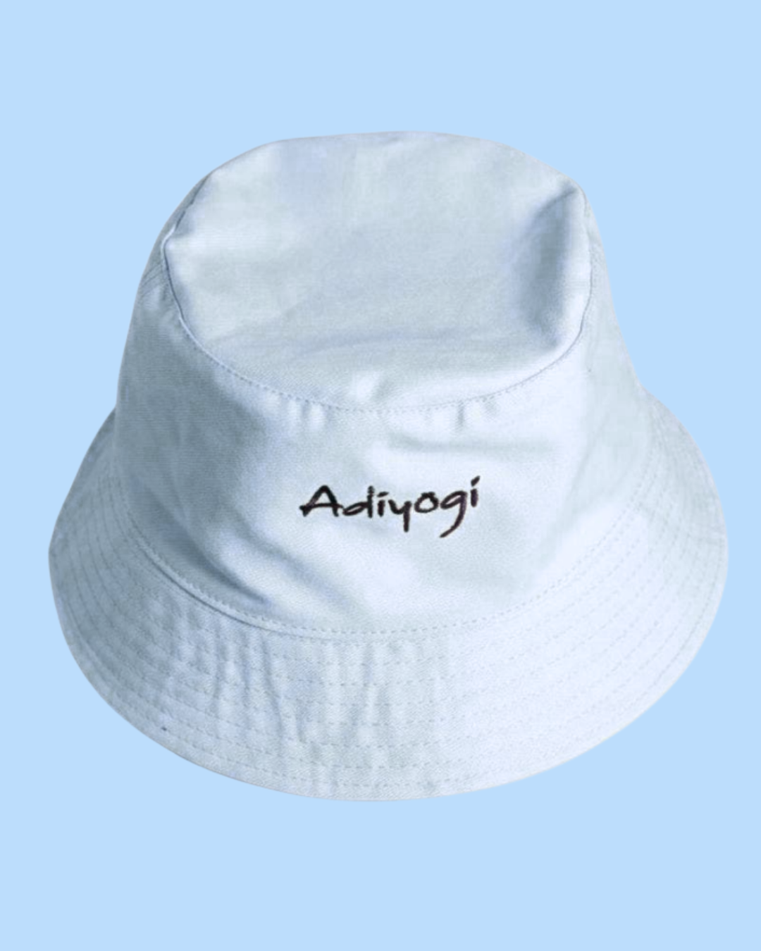 Stylish man poses in yellow hoodie against urban building backdrop.