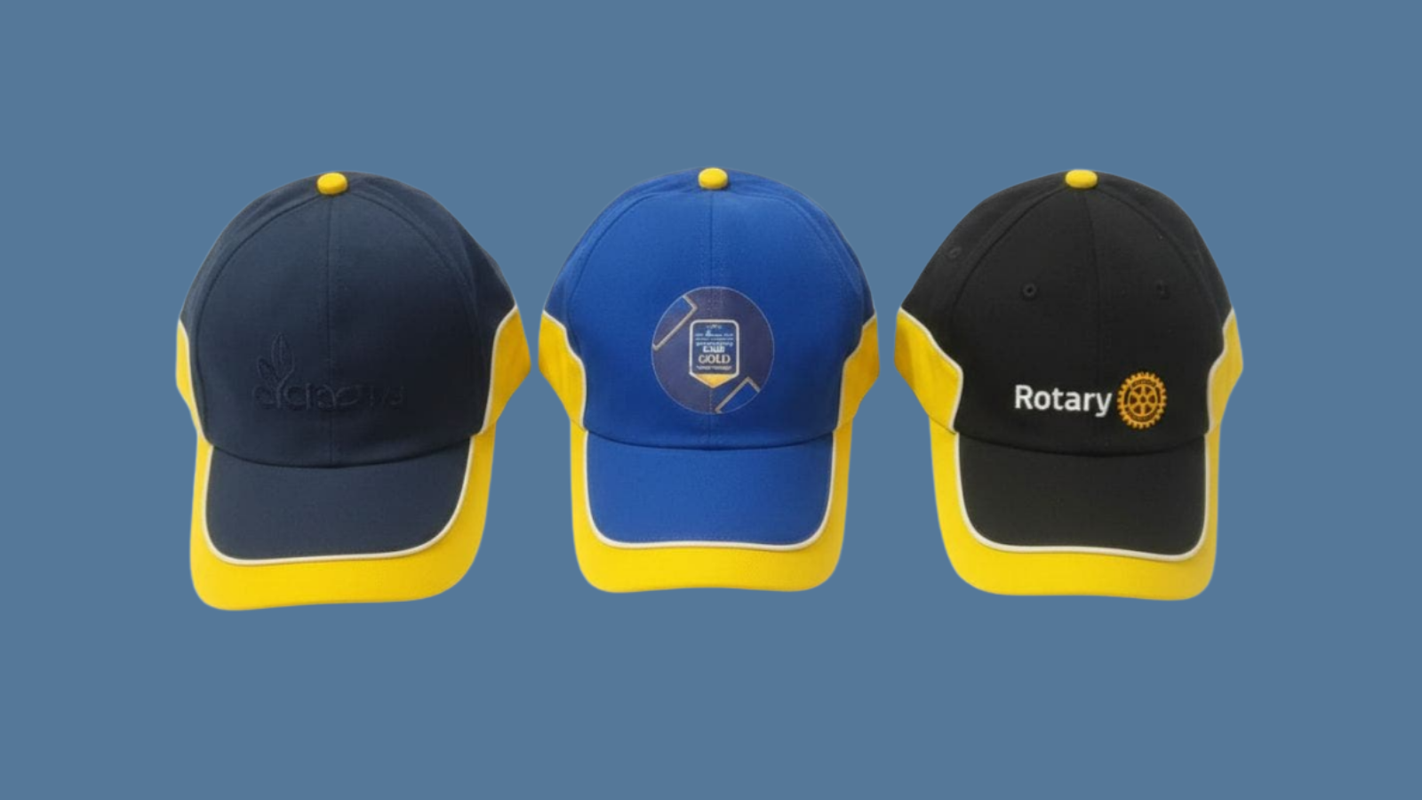 Two young adults wearing trendy hoodies and sunglasses standing outdoors.